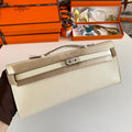 HERMES KELLY CUT 31 IN BEIGE CREAM CALFSKIN WITH SILVER HARDWARE