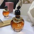 Pure XS for Her amber bottle