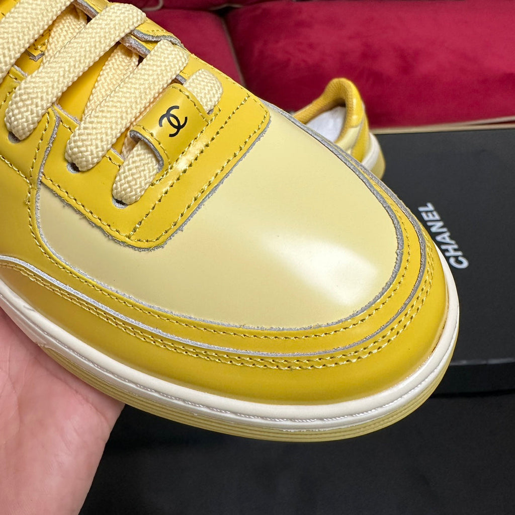 CHANEL TRAINERS IN BRIGHT YELLOW SHINY CALFSKIN